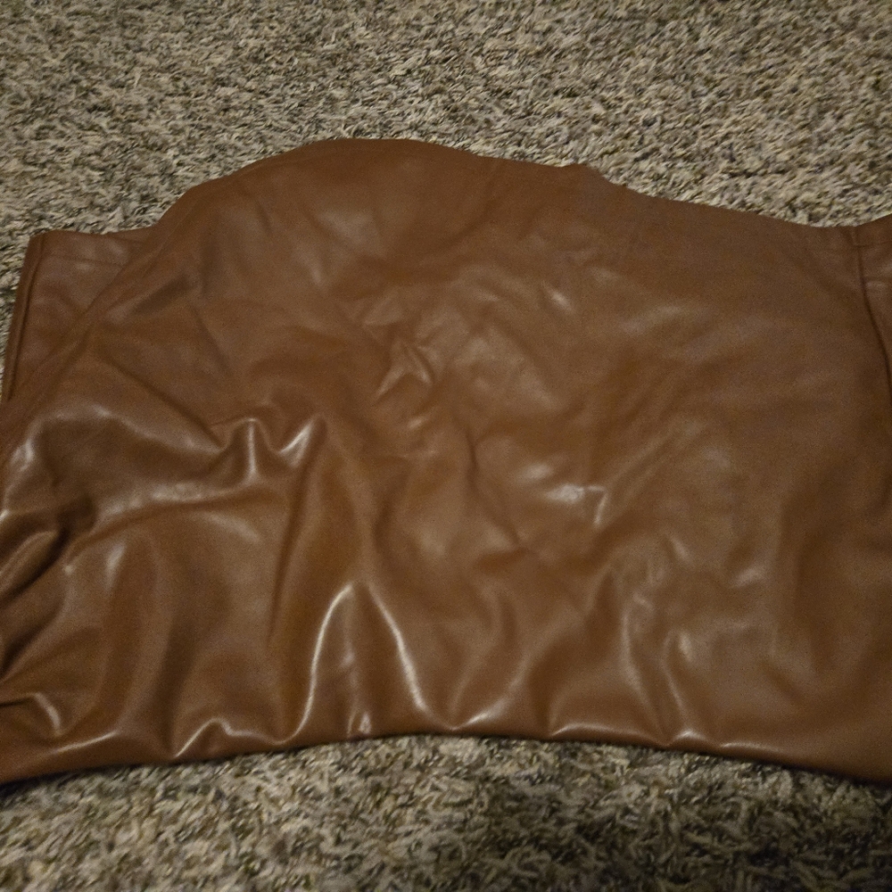 Brown leather skirt in front, shorts in back